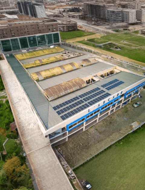 Aerial view of a commercial rooftop solar installation